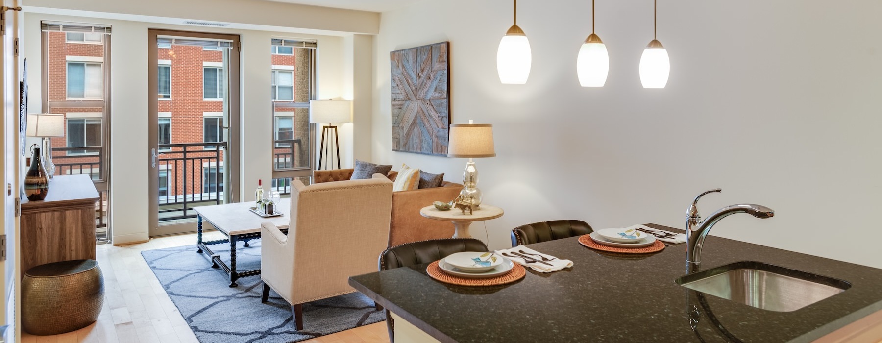 a kitchen and living room with an island and a couch