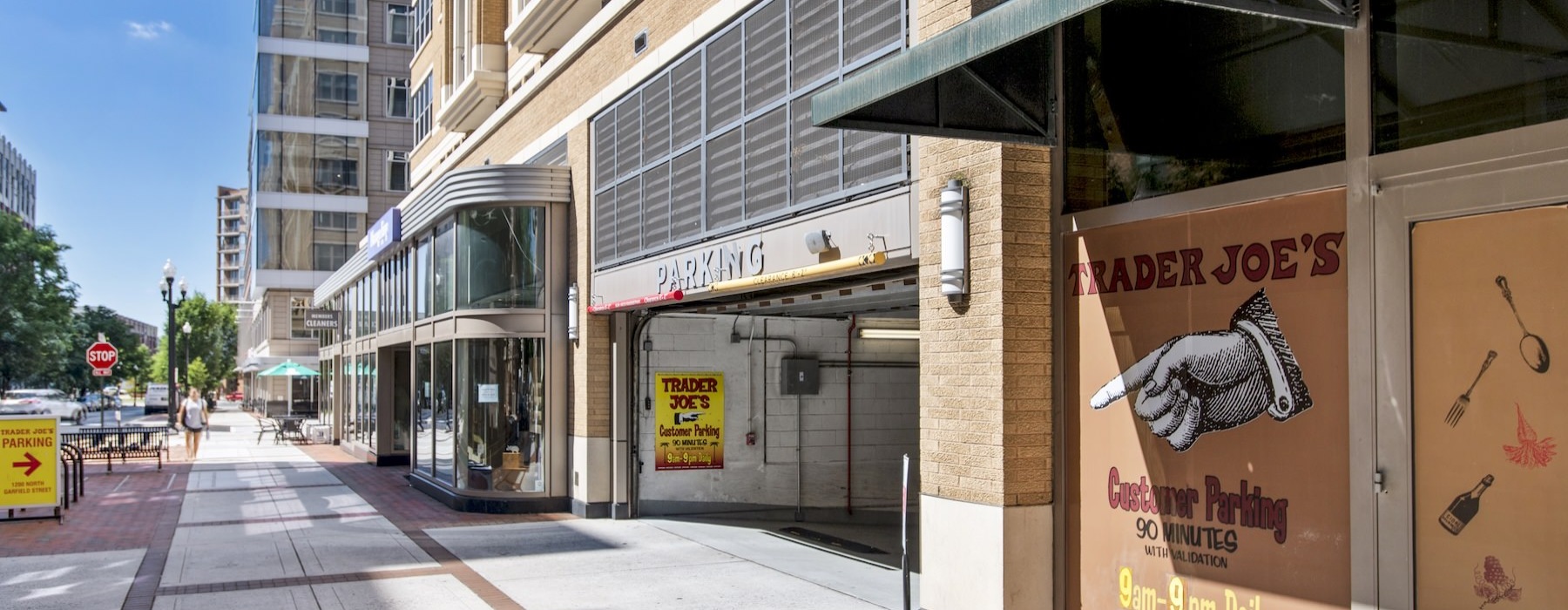 a sidewalk with signs on it