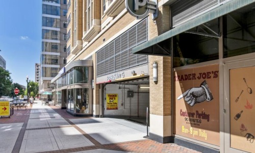 a sidewalk with signs on it